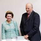 Queen Sonja and King Harald by the model of the Opera House in Oslo, a gift to the Museum of Modern Art   (Photo: Lise Åserud / Scanpix